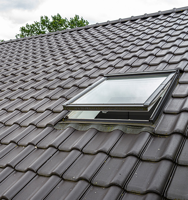 two-open-roof-windows-attic-visible-anthracite-ceramic-tiles